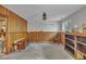 Spacious finished basement features wood paneling and neutral carpeting for a versatile living space at 320 Bainbridge Cir, Garner, NC 27529