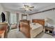 Cozy bedroom with a ceiling fan, carpeted floors, and a comfortable bed at 320 Bainbridge Cir, Garner, NC 27529
