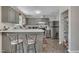 The kitchen features an eat-in bar, stainless steel appliances, and ample cabinet space at 320 Bainbridge Cir, Garner, NC 27529
