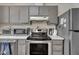 Kitchen appliances include a stainless steel oven, microwave, and refrigerator at 320 Bainbridge Cir, Garner, NC 27529