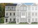 Charming townhome showcasing a stylish three-story design with varied siding and a welcoming front entrance at 324 Carolina Springs Blvd, Apex, NC 27539