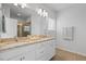 Bathroom featuring dual sinks, stone countertops, and vanity storage at 341 View Dr, Morrisville, NC 27560