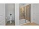 Bathroom featuring walk-in shower, tile floor, and toilet at 341 View Dr, Morrisville, NC 27560