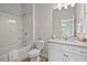 Bright bathroom features granite vanity and shower-tub combo at 341 View Dr, Morrisville, NC 27560