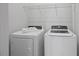 Laundry area with washer, dryer, and wire shelving at 341 View Dr, Morrisville, NC 27560