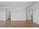 Bright, open living space with hardwood floors and modern lighting fixtures at 341 View Dr, Morrisville, NC 27560