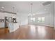 Spacious open-concept area with hardwood floors, recessed lighting, modern kitchen, and ample natural light at 341 View Dr, Morrisville, NC 27560