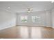 Bright, neutral living space featuring hardwood floors, recessed lighting, and large windows offering scenic views at 341 View Dr, Morrisville, NC 27560