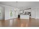 Bright living space featuring hardwood floors, recessed lights, open floorplan, and access to the outdoors at 341 View Dr, Morrisville, NC 27560