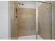 Frameless glass shower enclosure with tile surround and built in bench at 341 View Dr, Morrisville, NC 27560