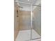 Frameless glass shower enclosure with tile surround and built in bench at 341 View Dr, Morrisville, NC 27560
