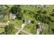 An aerial of the home and lot in the neighborhood, showcasing the lush landscaping and surrounding houses at 3525 Daisy Ln, Wake Forest, NC 27587