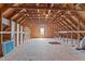 Spacious attic showing exposed wood framing and room for storage or potential conversion at 3525 Daisy Ln, Wake Forest, NC 27587