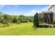 Expansive backyard with lush greenery and a screened-in porch at 3525 Daisy Ln, Wake Forest, NC 27587