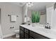 Bathroom featuring a double sink vanity, decorative plants, and sleek fixtures for a spa-like experience at 3525 Daisy Ln, Wake Forest, NC 27587