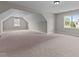 Spacious bonus room featuring multiple windows and neutral carpeting, perfect for flexible living at 3525 Daisy Ln, Wake Forest, NC 27587
