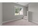 Cozy bonus room featuring neutral walls, carpeting, and natural light, perfect for relaxation at 3525 Daisy Ln, Wake Forest, NC 27587