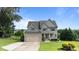 Attractive two-story home with a well-maintained lawn and a two-car garage at 3525 Daisy Ln, Wake Forest, NC 27587