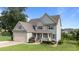 Charming two-story home with a well-manicured lawn, a two car garage, and inviting curb appeal at 3525 Daisy Ln, Wake Forest, NC 27587