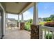 Covered porch with stone supports offering scenic views of the neighborhood at 3525 Daisy Ln, Wake Forest, NC 27587
