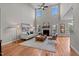 Bright living room with high ceilings, fireplace, and large windows at 3525 Daisy Ln, Wake Forest, NC 27587