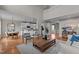 Spacious open-concept living room with wood floors, leading to the dining and kitchen areas at 3525 Daisy Ln, Wake Forest, NC 27587