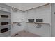 Organized walk-in closet with built-in shelving, hanging rods, and carpeted flooring at 3525 Daisy Ln, Wake Forest, NC 27587