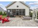Backyard patio with hot tub, grill, swing set, and screened porch with fans at 3829 Sleepy Brook Ln, Apex, NC 27539
