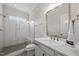 Modern bathroom featuring a glass-enclosed shower, white vanity, and stylish fixtures for a spa-like experience at 3829 Sleepy Brook Ln, Apex, NC 27539