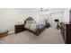 Bright bedroom featuring carpet, ceiling fan, exercise equipment, and stylish furniture set at 3829 Sleepy Brook Ln, Apex, NC 27539