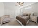 Comfortable bedroom with soft carpet, natural light, a side table with drawers, and an adjacent crib at 3829 Sleepy Brook Ln, Apex, NC 27539