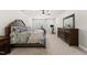 Bright bedroom featuring carpet, ceiling fan, exercise equipment, and stylish furniture set at 3829 Sleepy Brook Ln, Apex, NC 27539