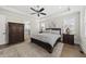 Spacious bedroom with stylish furniture, decorative rug and ensuite bathroom with tub at 3829 Sleepy Brook Ln, Apex, NC 27539