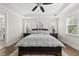 Bright bedroom with a tray ceiling, neutral walls, and a comfy bed at 3829 Sleepy Brook Ln, Apex, NC 27539
