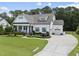 Charming, modern farmhouse-style home featuring a well-manicured lawn and a spacious driveway at 3829 Sleepy Brook Ln, Apex, NC 27539