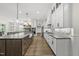 Spacious kitchen featuring custom cabinetry, an island, and a dining area perfect for cooking and entertaining at 3829 Sleepy Brook Ln, Apex, NC 27539