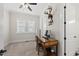 Cozy office space featuring a desk, built-in shelves, and ample natural light perfect for working from home at 3829 Sleepy Brook Ln, Apex, NC 27539