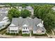 Aerial view of the townhome community with lush green trees and well-maintained exteriors at 3902 Stags Leap Cir, Raleigh, NC 27612