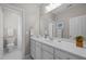Bathroom featuring white marble countertop vanity and separate water closet at 3902 Stags Leap Cir, Raleigh, NC 27612