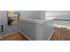 Hallway with hardwood floors, gray walls, white trim, and an abstract painting on the wall at 3902 Stags Leap Cir, Raleigh, NC 27612