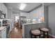 Updated kitchen with stainless steel appliances, granite countertops, white cabinetry, and breakfast bar at 3902 Stags Leap Cir, Raleigh, NC 27612