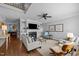 Bright living room with fireplace, built-in shelves, and hardwood floors at 3902 Stags Leap Cir, Raleigh, NC 27612