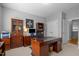 Spacious office with built-in shelving, neutral walls, and a large wooden desk at 3902 Stags Leap Cir, Raleigh, NC 27612