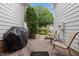 Private patio space with brick paving, outdoor seating, and a grill, perfect for relaxing at 3902 Stags Leap Cir, Raleigh, NC 27612