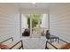 Covered screened porch with outdoor seating and decorative elements creating a relaxing space at 3902 Stags Leap Cir, Raleigh, NC 27612