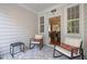 Cozy screened porch with comfortable seating offering a view to the dining and kitchen areas at 3902 Stags Leap Cir, Raleigh, NC 27612
