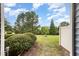Well-maintained back yard with green grass and mature landscaping at 404 Panorama Park Pl, Cary, NC 27519