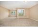Bright bedroom features neutral carpet, paint, and trim and large windows at 404 Panorama Park Pl, Cary, NC 27519