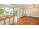 Spacious dining room with hardwood floors and sliding glass doors to outdoor patio at 404 Panorama Park Pl, Cary, NC 27519