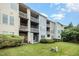 Apartment complex exterior with private balconies, lawns and manicured bushes at 404 Panorama Park Pl, Cary, NC 27519